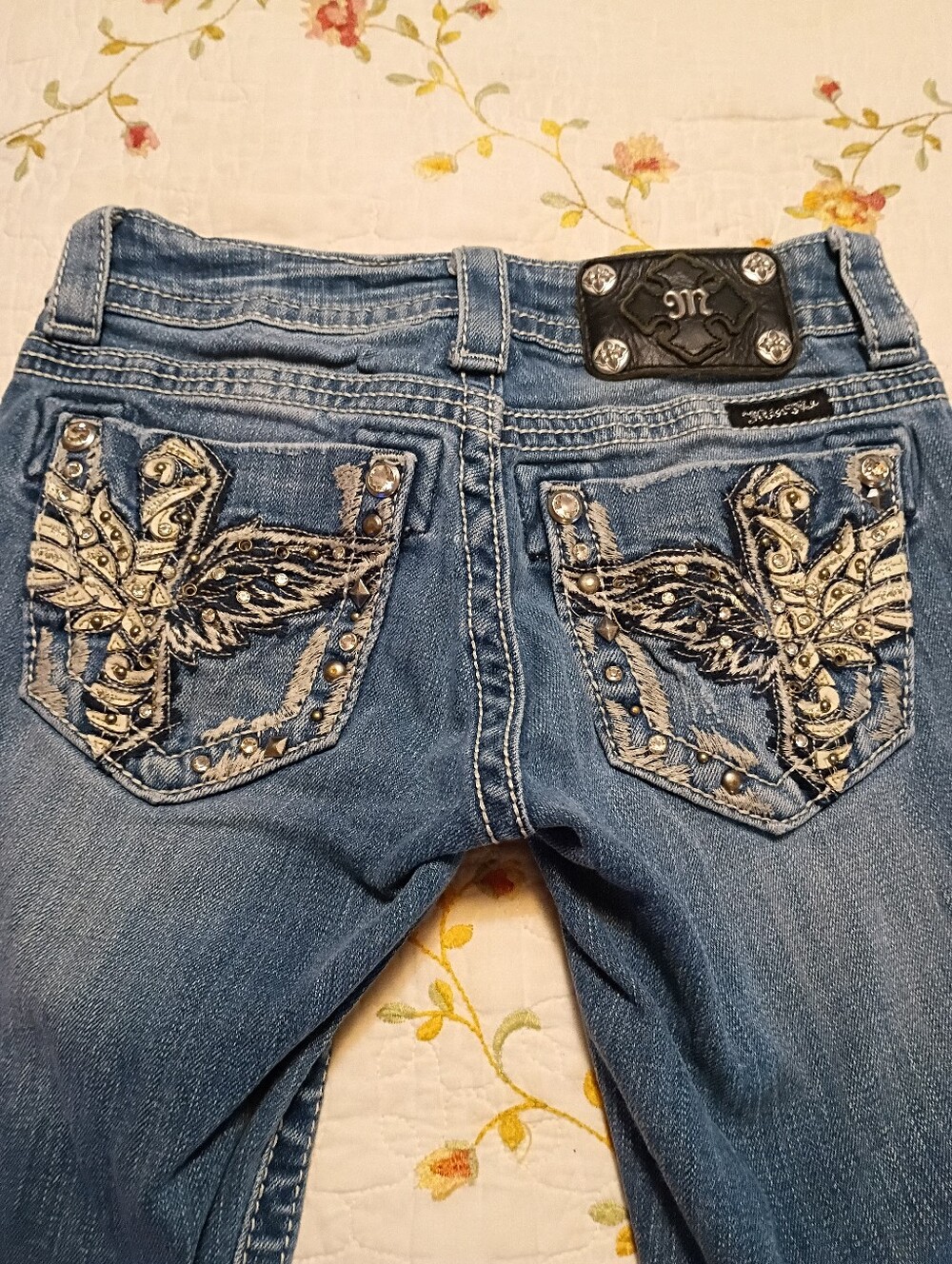 Embellished Blue Women's Jeans with Wing Pocket Detail. 23 Waist By 31 Boot Cut